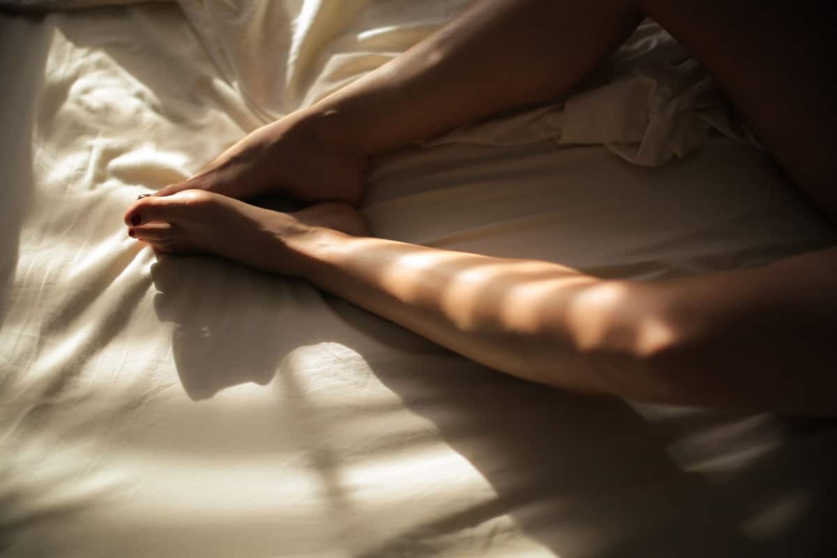 Hand shadow on bed
